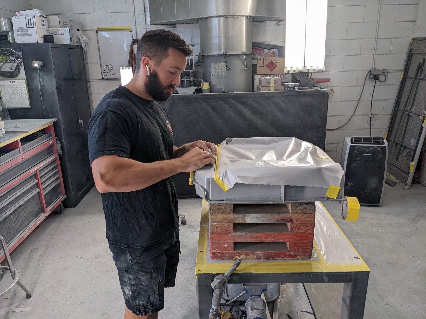 Justin working on a high-end automotive restoration